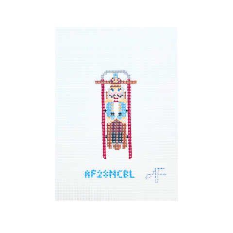 Sled with Blue Nutcracker — Anne Fisher Needlepoint