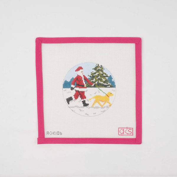 Sporty Santa walking a yellow Labrador